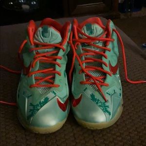 Green and orange Nike tennis shoes